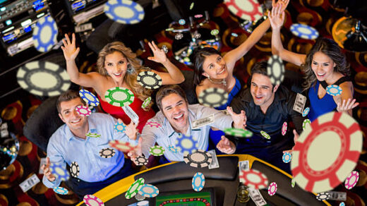Happy group of people winning at the casino