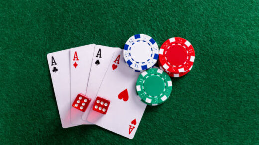 Four aces and gambling chips on the table.