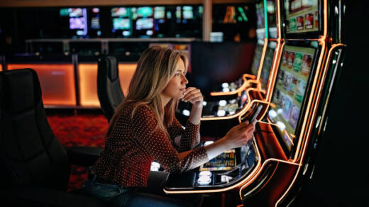Women gambling on slot machinery