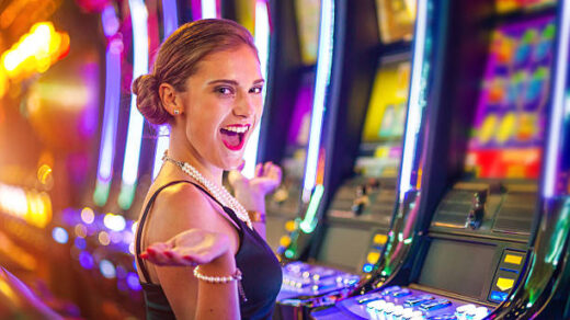 Young woman playing slot machines at the Casino